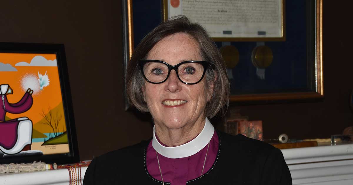 Headshot of Archbishop Anne Germond in an office