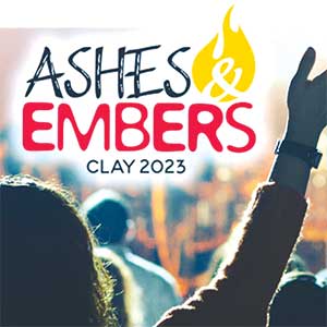 Ashes and Embers: CLAY 2023 logo superimposed on a young person raising their hand in praise