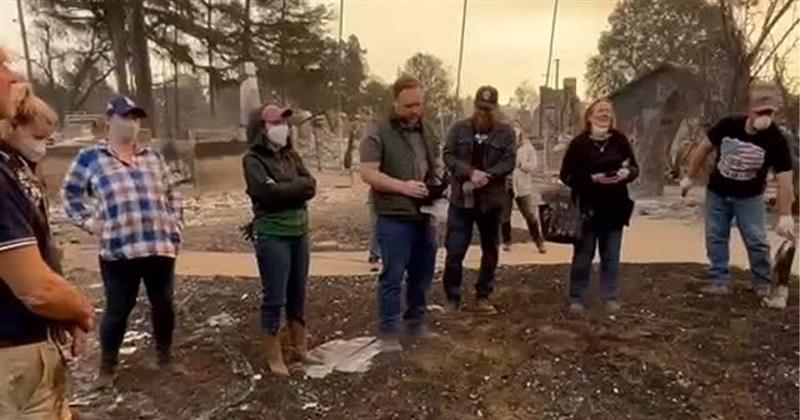 Members of the Halpin family sing a hymn to Mary at the site of the home they lost to January wildfires in California. Photo: Instagram